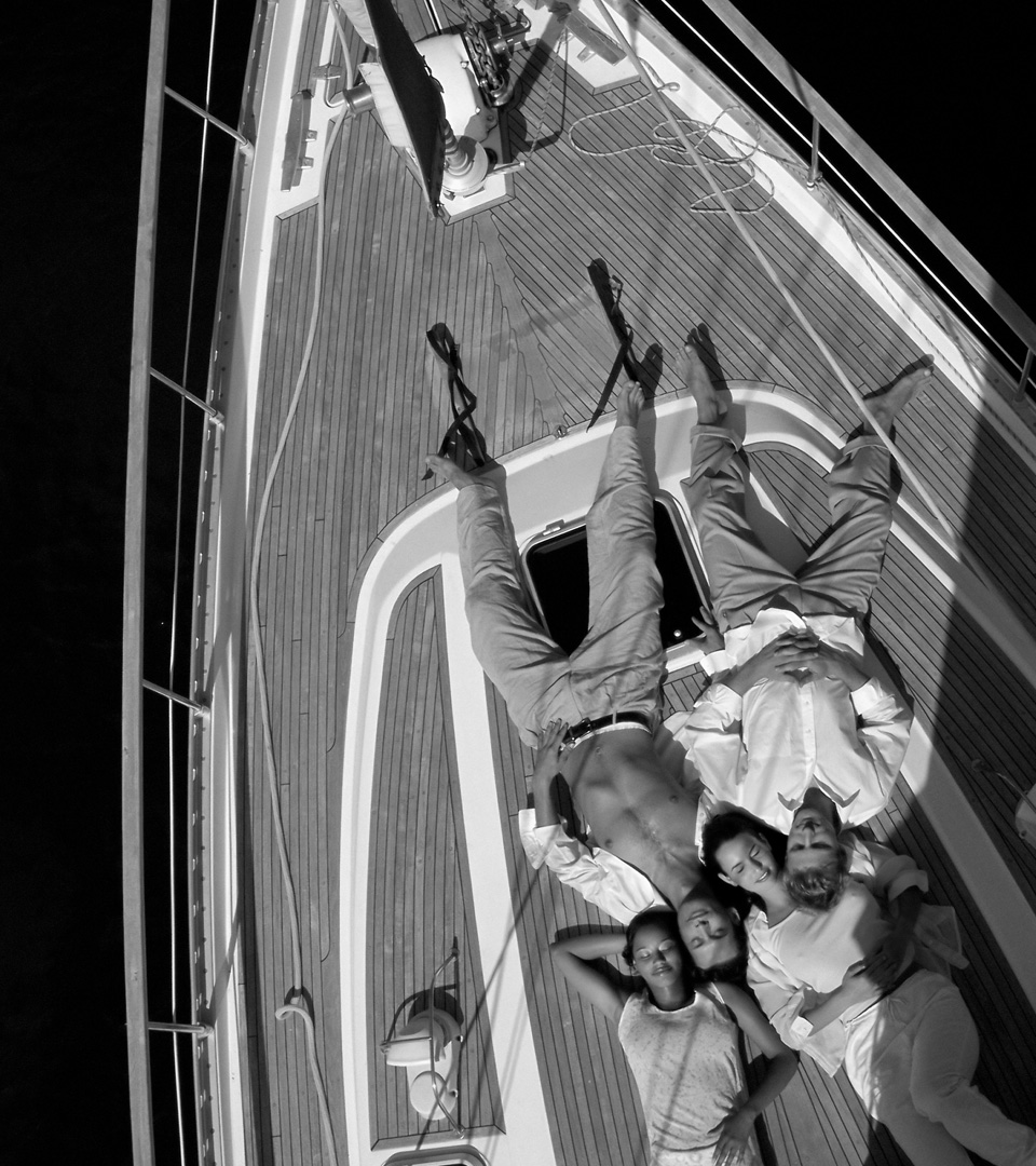 Black and white image of two couples on a boat