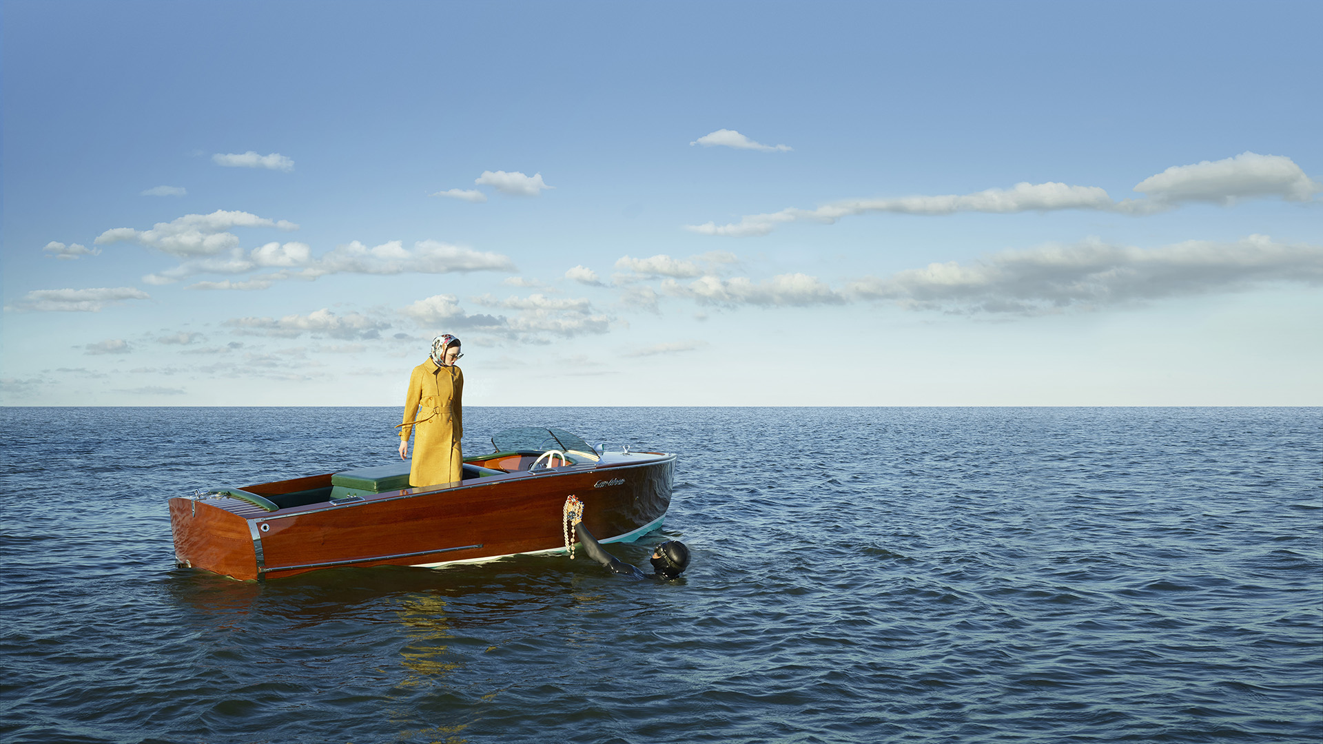 echelon seaport woman in boat with yellow coat full image