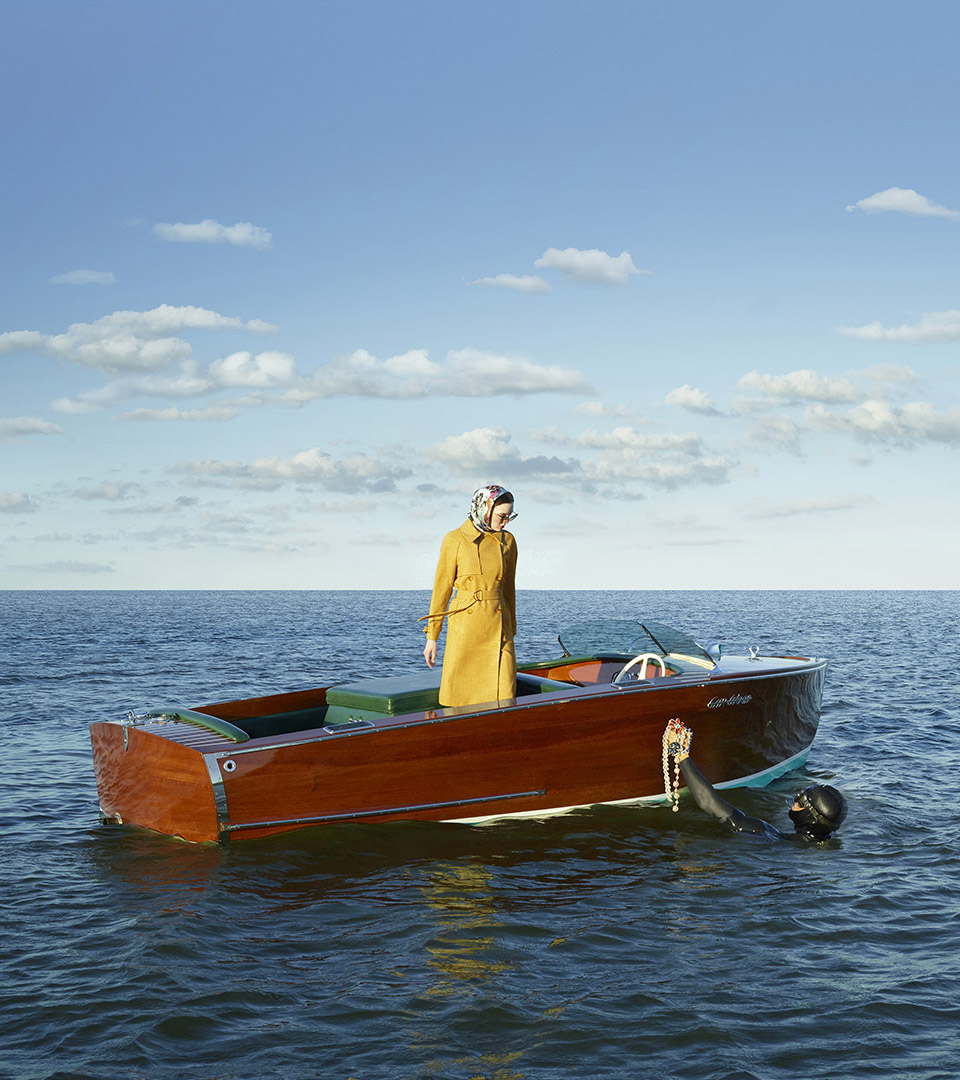 echelon seaport woman in boat with yellow coat vertical