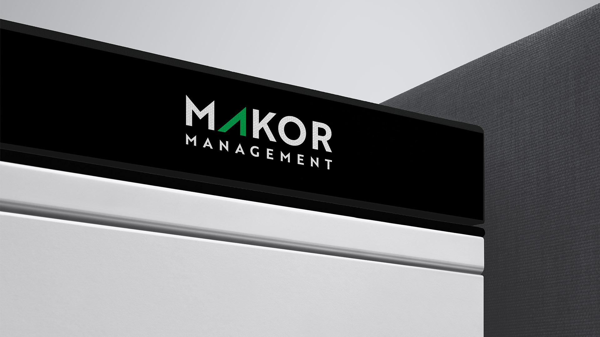 makor management logo on black book