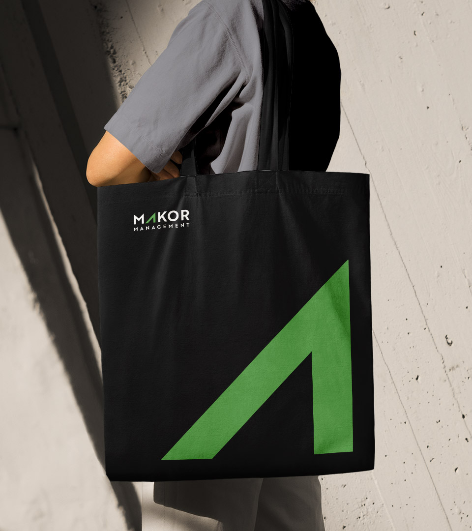 makor management tote bag with green arrow