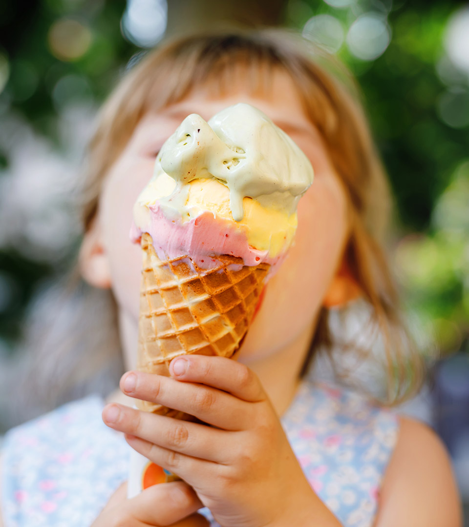 newbury street girl with ice cream cone in front of her face