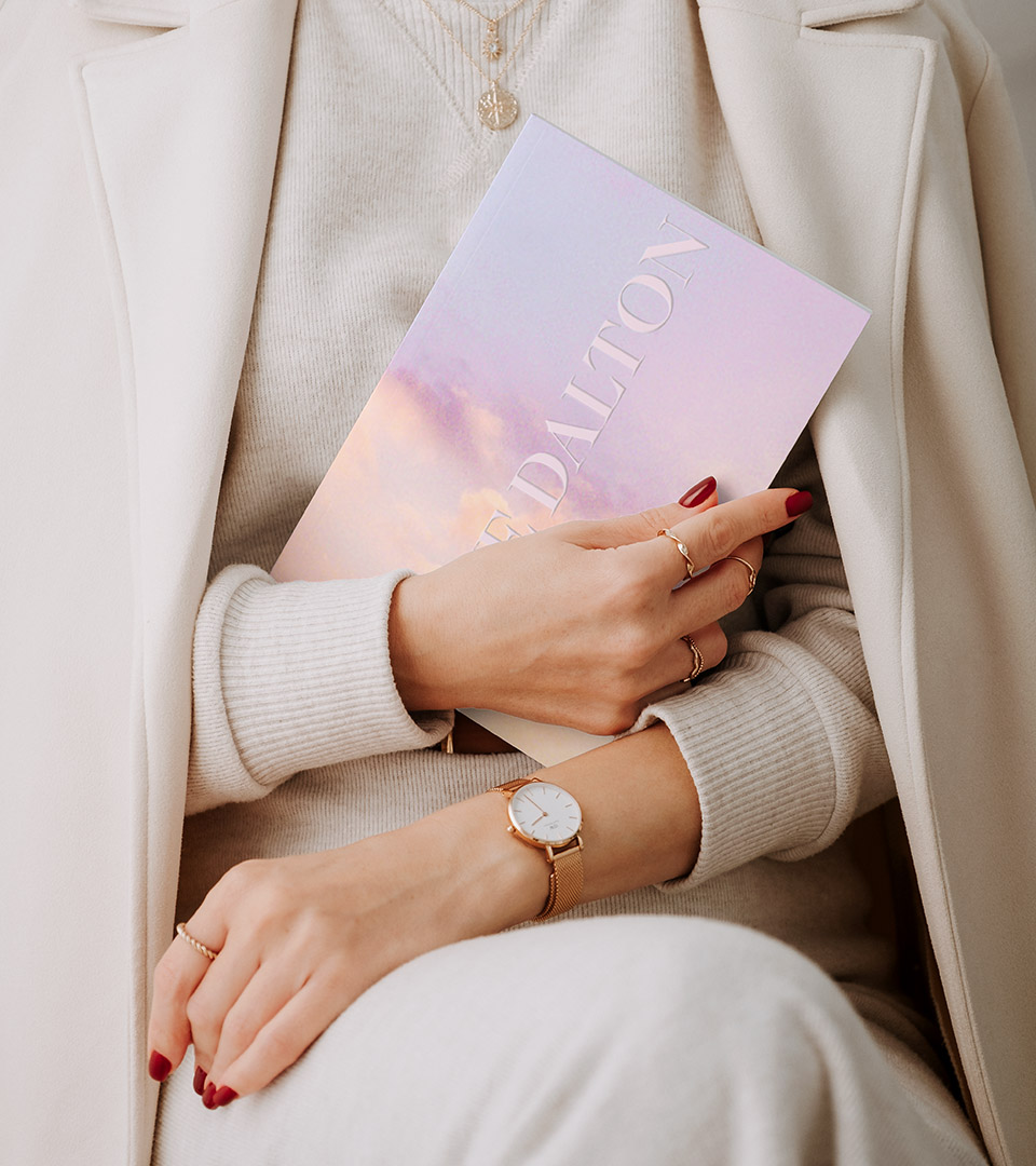 one dalton woman holding brochure