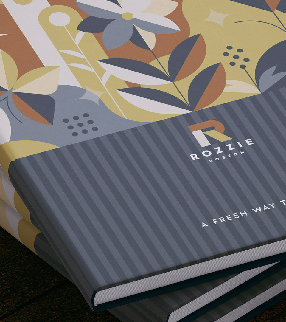 rozzie boston brochure cover books stacked by boston graphic design studio