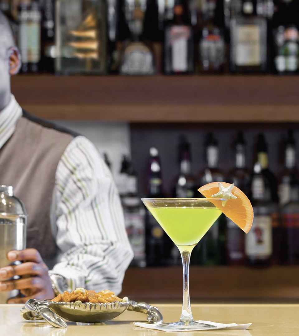 seaport hotel bartender with green martini