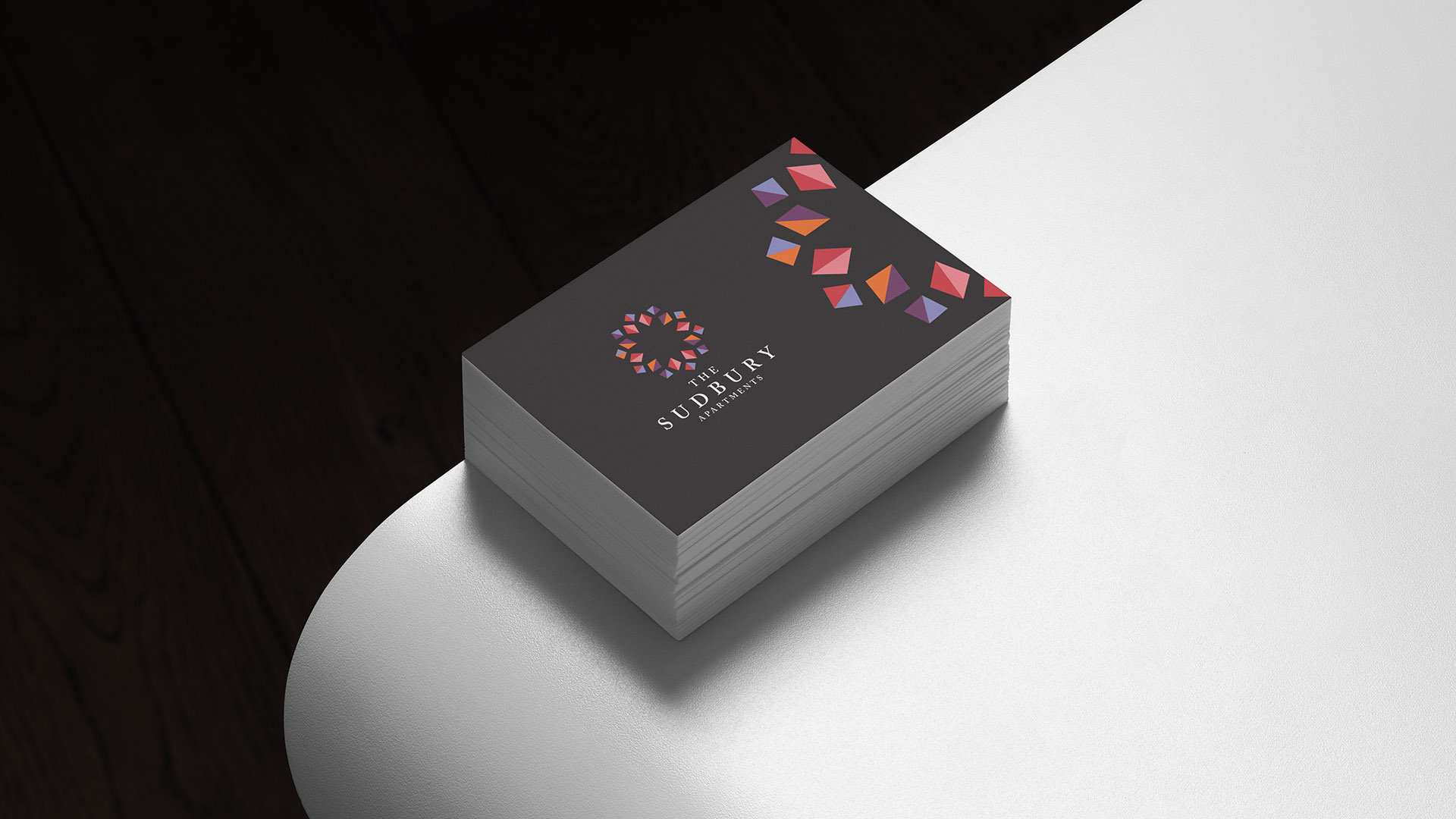 sudbury apartments business card on curved white table