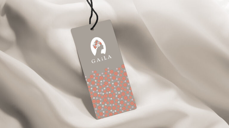 the gaila fund hang tag on white silk fabric for packaging by boston graphic design studio