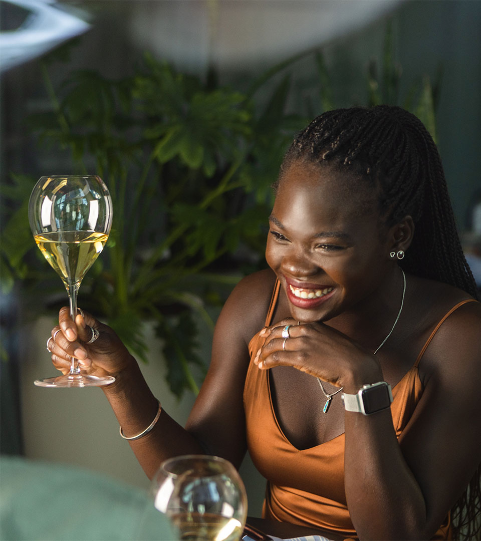 vela seaport black woman with wine glass